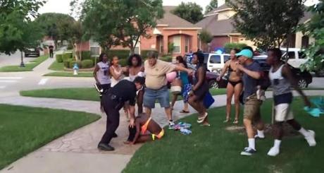 A video still shows a McKinney, Texas, police officer pushing a girl to the ground.
