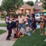 A video still shows a McKinney, Texas, police officer pushing a girl to the ground.