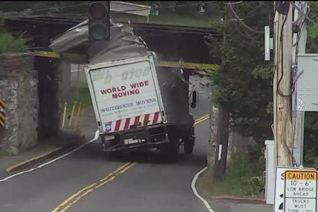A white moving truck was the latest victim at the East Street bridge in Westwood.
