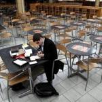 A man took advantage of a power outage to write thank-you letters in an empty food court at the Shops at the Prudential. The food court will be replaced by a massive Eataly marketplace, tbhe brainchild of Mario Batali.