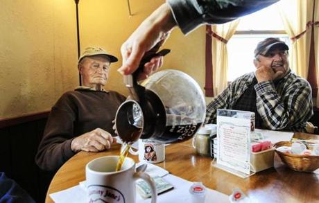 Lyle Moody (left) and Dana Leonard, two members of Warren, N.H.?s, ?men?s coffee club? enjoy a cup of brew and conversation about anything that comes up at Calamity Jane?s Restaurant.
