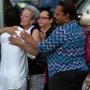 Boston, MA - 06/10/15 Chantey Pagan, 32, in white back to camera, is comforted outside the Brady Fallon Funeral Home where friends and family mourned Yadielys Deleon Camacho who was killed by a hit and run driver. Pagan is the mother of Joseph Eduardo Cordova, 12, who was also struck by the same hit and run driver and who remains hospitalized. - (Barry Chin/Globe Staff), Section: Metro, Reporter: Travis Andersen, Topic: 11funeral, LOID: 8.1.1326762908. 
