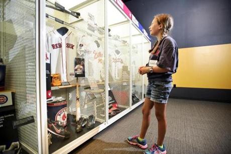 Red Sox fan Katelyn Abel, 10, admires Red Sox memorabilia in the Baseball Hall of Fame.
