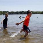 Jackson Mangion, 7, (left) and Dominic Mastroianni, 7, of Norfolk play in Lake Pearl.