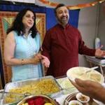 Madhu Nene (left) and Shashank Nene served Indian trail mix at the Nibble Open Kitchens event Sunday.