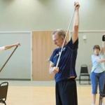 Mike Leath, a retired chiropractor, led an exercise class at the senior center in Waxahachie, Texas, a middle-income community where retirees have settled. Those between 65 and 74, supported by Social Security, pensions, and investments, have fared better than most other groups, an analysis shows. 