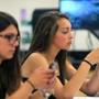 Melrose High students Beatrice Affatato (left) and Miranda Lombardo use smartphones in Blair Cochran?s physics class.