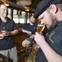 Jay sullivan, right, lead brewer at cambridge Brewing Company samples an Enlightenment Ale ( A golden Belgain ale produced at Enlightenment Ales) as Chris Tkach (sp) of Idle Hands Craft Ales, left, and Sean Nolan, an assistant brewer at Cambridge Brewing Company, look on at the Boston Beer Week Kick off Party at Cambridge Brewing Company in Kendall Square. JOSH REYNOLDS FOR THE BOSTON GLOBE (Living/Arts, Goldstein)