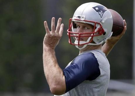 New England Patriots quarterback Tom Brady throws a pass during an NFL football organized team activity, Thursday, June 11, 2015, in Foxborough, Mass. (AP Photo/Elise Amendola)
