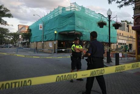 Streets and sidewalks near Davis Square will be closed until further notice because of an unstable building.
