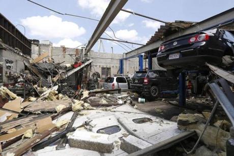 A damaged auto repair shop was seen in Revere after a rare tornado touched down in the city in July.
