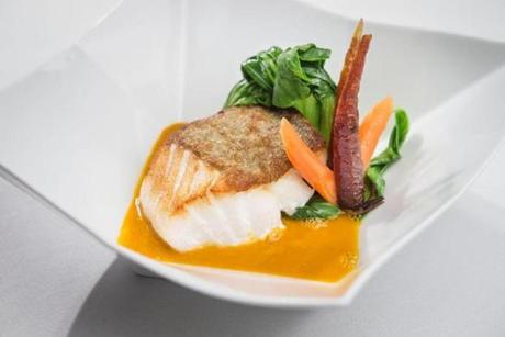 Cod loin, lightly cured in a spice rub, is served crisp-skinned in a curry broth with bok choy.
