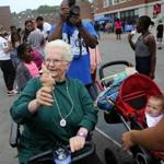 Anne Clancy took advantage of the free ice cream during Old Colony Unity Day in Boston on Saturday.