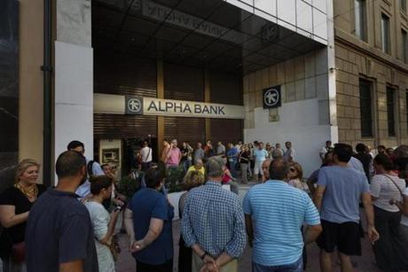 A line formed at banks ATM machines in central Athens on Sunday.
