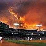 Storm clouds provided a colorful and appropriate backdrop during a game on June 23.