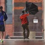 Javier Taylor struggled with his umbrella on Clarendon Street in the Back Bay on Sunday.
