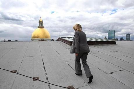Tammy Kraus walked on the roof of the State House with a view of its iconic dome. 
