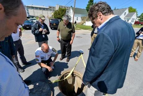 New York Governor Andrew Cuomo surveryed a manhole near the prison in Dannemora, N.Y., with other officials.
