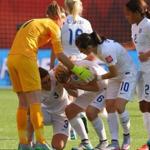 England?s Laura Bassett is consoled by teammates after her own goal resulted in Japan?s win. 