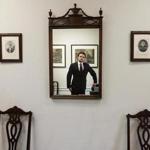 Jay Surdukowski reflected in a mirror in his office.  