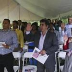 People from 21 countries pledged to become Americans during a citizenship ceremony in Minute Man National Park.