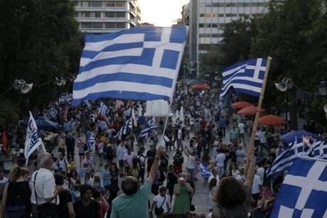 Supporters of the ?no? vote waved flags Sunday in Syntagma Square in Athens.
