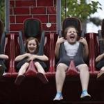 Young park-goers showed their enthusiasm on a ride at the Jefferson, N.H., amusement park.