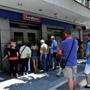 People lined up outside a bank in Thessaloniki on Monday.