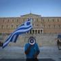 A man waved a Greek flag  in front of the Greek parliament during a pro-European rally on Thursday. 
