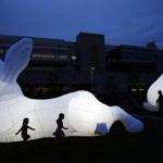 People walked by the art installation 'Intrude' at the Lawn on D on Thursday.  