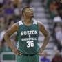 Boston Celtics' Marcus Smart (36) looks on during the second half of an NBA summer league basketball game against the San Antonio Spurs Thursday, July 9, 2015, in Salt Lake City. (AP Photo/Rick Bowmer) 