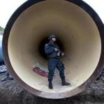 Mexican federal police guarded a drainage pipe outside of the prison from which a jailed druglord escaped on Saturday.