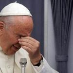 Pope Francis rubbed his eyes during a news conference aboard the papal plane on the return trip to Rome from South America. 