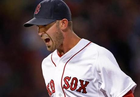 07/08/15: Boston, MA: The Red Sox took a 4-0 lead into the top of the 4th inning, but as he has done many times this season, Boston starting pitcher Rick Porcello gave Miami two quick runs back to cut the lead in half. It looked like he might give up more, as the Marlins had runners on second and third with two outs, but Porcello got himself out of the jam by making a nice lunging play on a ball headed up the middle off the bat of Miami's Christian Yelich. He then threw him out at first to end the inning and the play elicited a howl from Porcello as he headed for the dugout. The Boston Red Sox hosted the Miami Marlins in an inter league MLB baseball game at Fenway Park. (Globe Staff Photo/Jim Davis) section:sports topic:Red Sox-Marlins (1)

