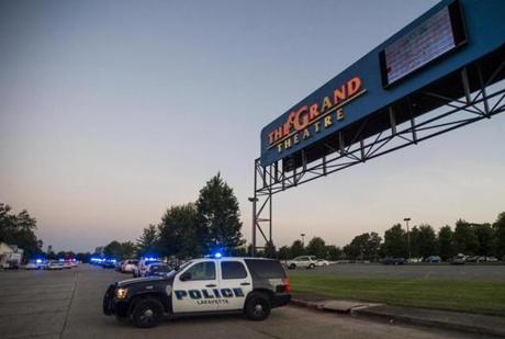 A Lafayette Police Department vehicle blocked an entrance at The Grand Theatre in Lafayette, La., following a shooting at the theater on Thursday. 
