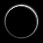 Backlit by the sun, Pluto?s atmosphere rings its silhouette like a luminous halo in this image taken by NASAs New Horizons spacecraft.