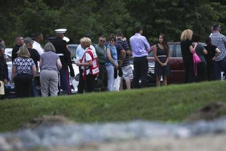 Visitors waited in line at the Sampson Chapel of The Acres in Springfield for the wake of Thomas Sullivan on Sunday.
