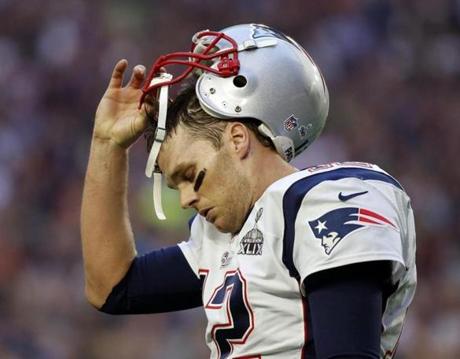 Tom Brady walked to the sideline after throwing an interception in the first quarter of Super Bowl XLIX against the Seahawks in Glendale, Ariz., on Feb. 1.
