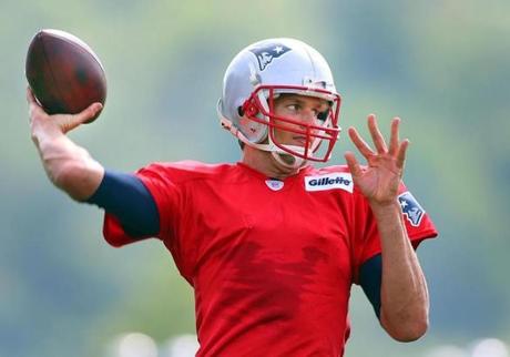 Tom Brady fired a pass during the first day of training camp for the Patriots.
