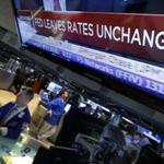 A television screen on the floor of the New York Stock Exchange showed the decision of the Federal Reserve on Wednesday. The central bank appears on track to raise interest rates this year but is signaling that it wants to see further economic gains and higher inflation before doing so.