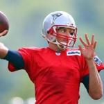 Tom Brady fired a pass during the first day of training camp for the Patriots.