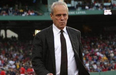 Boston, MA - 06/05/15 - (2nd inning) A concerned Larry Lucchino follows the stretcher taking the fan out of the park. The Boston Red Sox take on the Oakland Athletics in Game 1 of a three game series at Fenway Park. - (), Section: Sports, Reporter: Julian Benbow, Topic: 06Red Sox-A's, LOID: 8.1.1046911126. 
