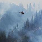 Helicopters dropped water on the Blue Creek wildfire as it burned near Walla Walla, Wash.