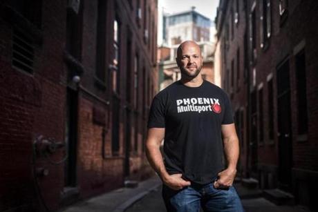 Scott Strode, who founded peer-to-peer recovery organization Phoenix Multisport after getting clean, pictured in an area in Boston where he used to buy drugs. 
