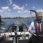 Mayor Jon Mitchell of New Bedford rode on the harbor master?s boat. ?We?re continuing to hit the singles and doubles of economic development. There isn?t anything sexy about those types of efforts,? he says.
