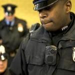 Philadelphia police officers demonstrated a body-worn camera as part of a pilot program.