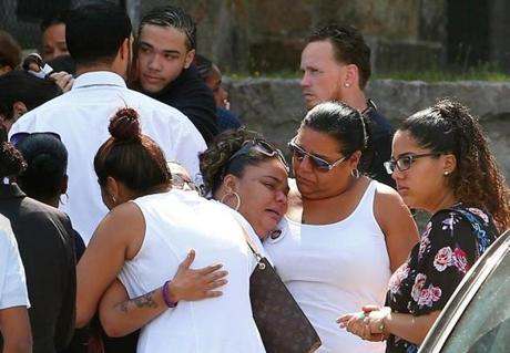 Mourners consoled one another outside St. Peter Parish in Dorchester on Tuesday at the funeral for Grisel Sanchez.

