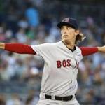 Red Sox rookie Henry Owens winds up in the second inning of his debut. He gave up three runs in five innings. 
