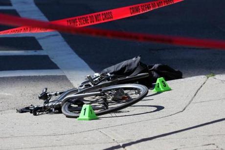 Police and crime investigators were on the scene after a bicyclist killed Friday when she was hit by a tractor-trailer near the intersection of Beacon Street and Massachusetts Avenue.
