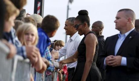 President Barack Obama and Michelle Obama greeted well-wishers upon arrival on Martha's Vineyard on Friday.
